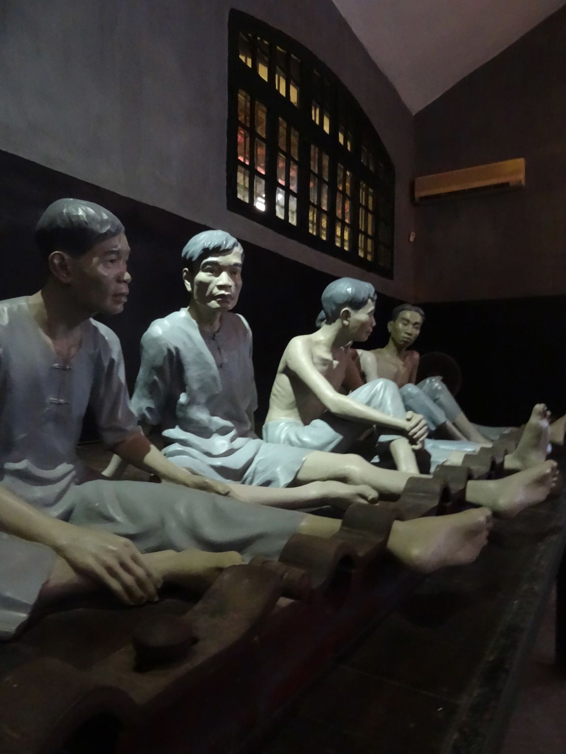 Effigies of shackled inmates at At Hoa Lo Prison. 