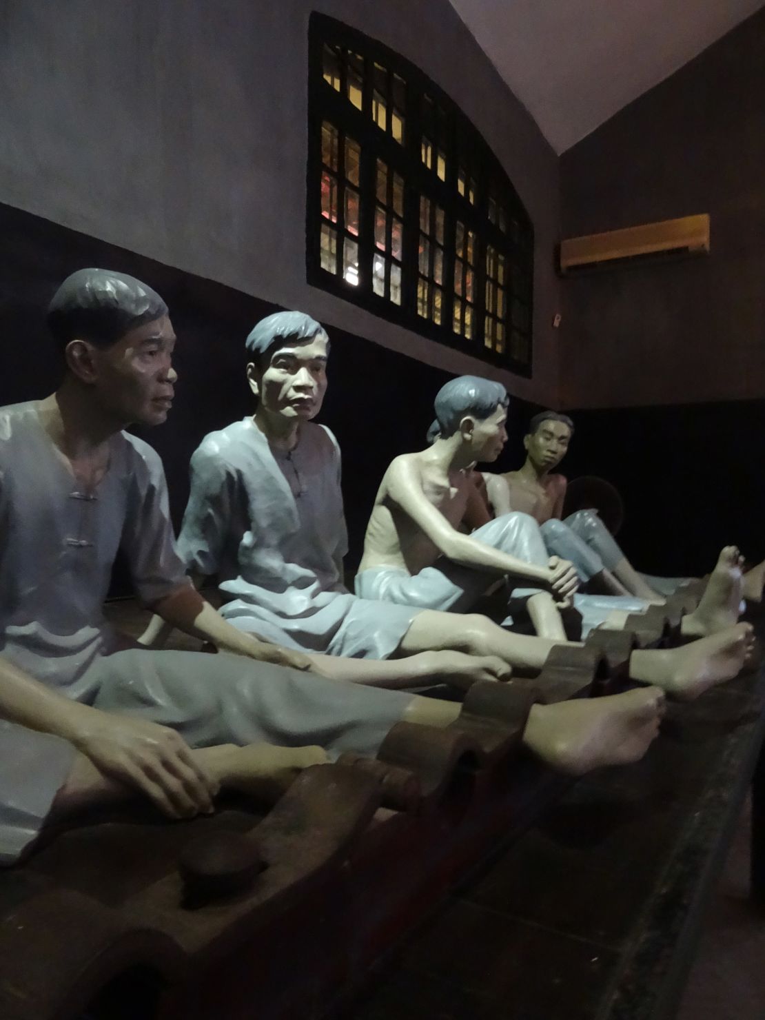 Effigies of shackled inmates at At Hoa Lo Prison.