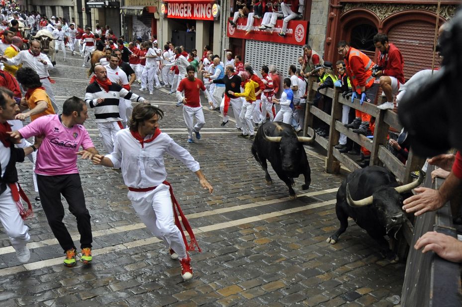 Participants run in front of bulls on July 9.