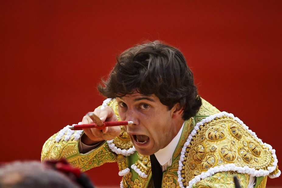 Bullfighter Juan del Alamo kills a bull with his sword on July 9.