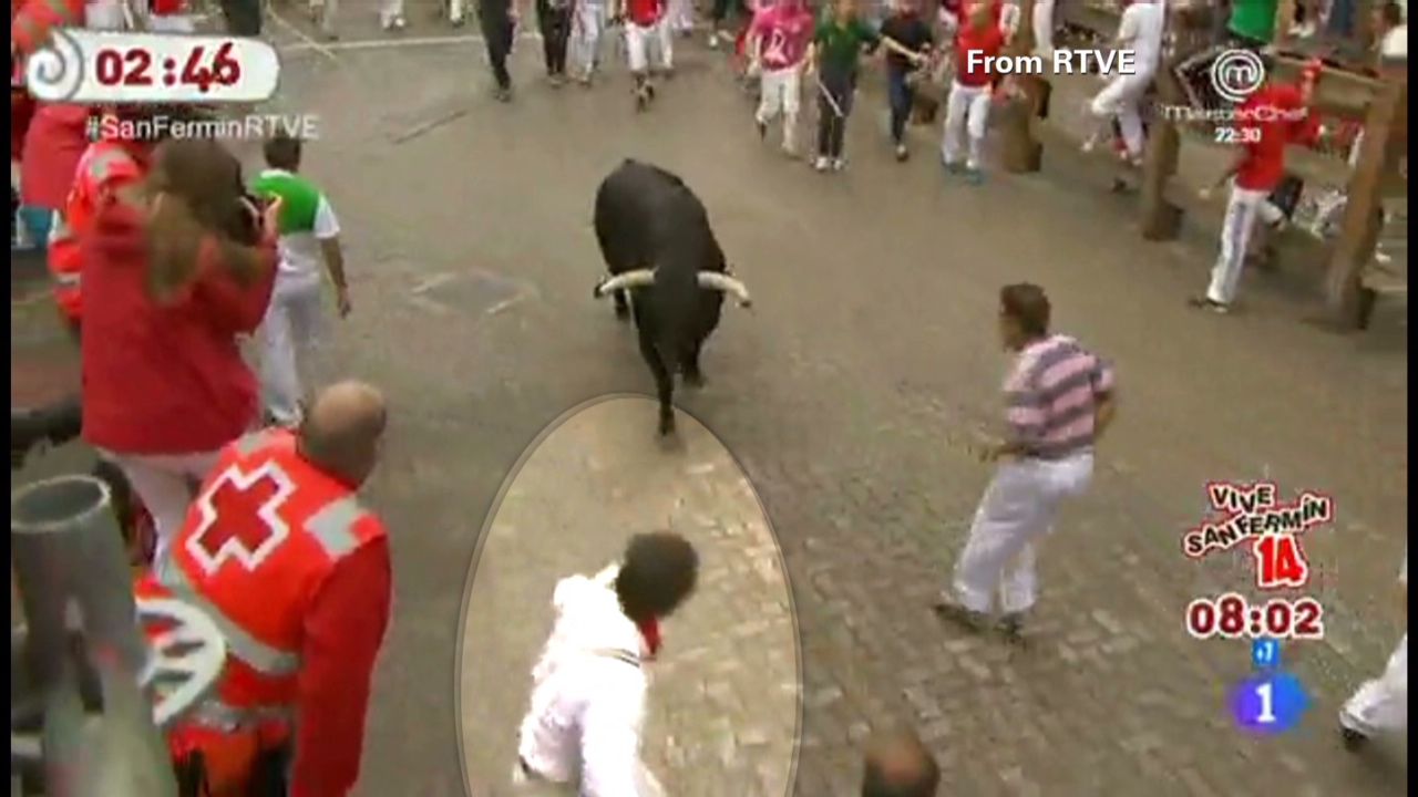 police-hunt-pamplona-bull-run-selfie-man-cnn