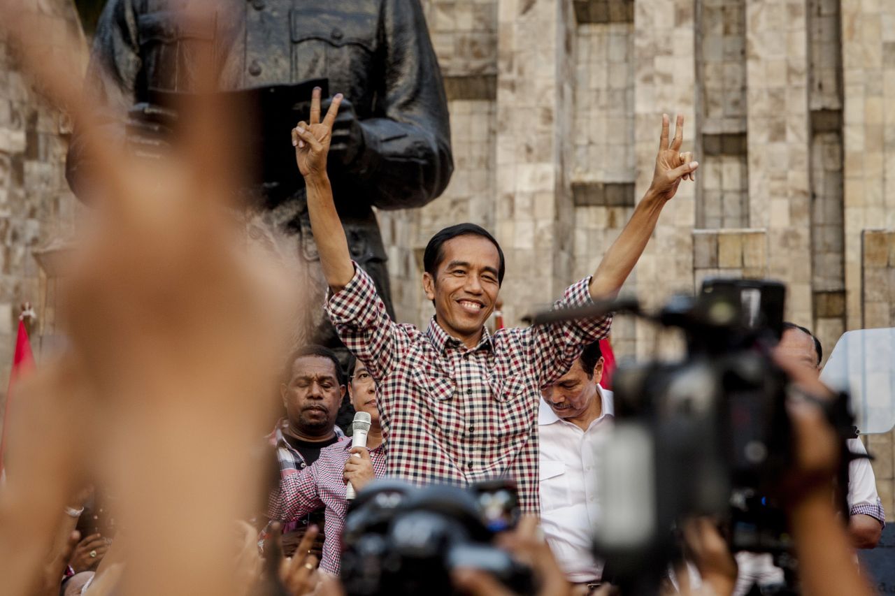 Indonesian presidential candidate Joko Widodo greets his supporters as he declares victory in the election. But official election results are expected July 22. 