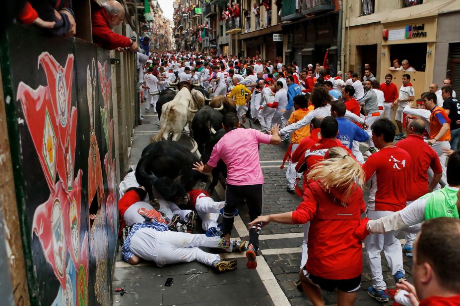 Bulls run over revelers on Thursday, July 10.