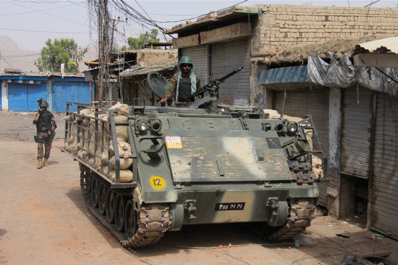 A Pakistan army armored vehicle rolls into the streets of Miranshah.