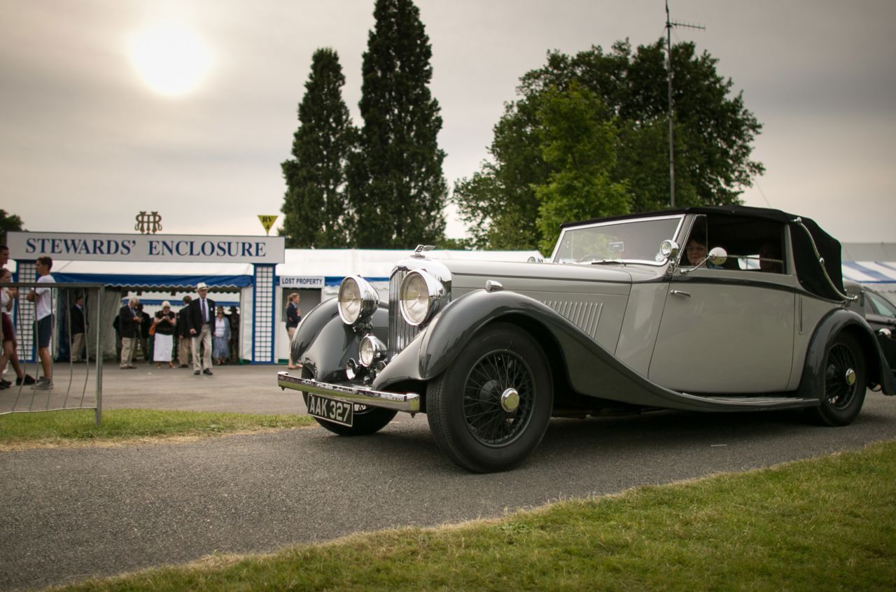 Here, visitors to the 2014 regatta leave in a 1930s Bentley car.