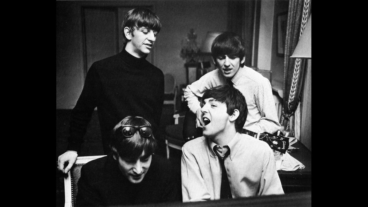 The Beatles compose music at a hotel in Paris in 1964.