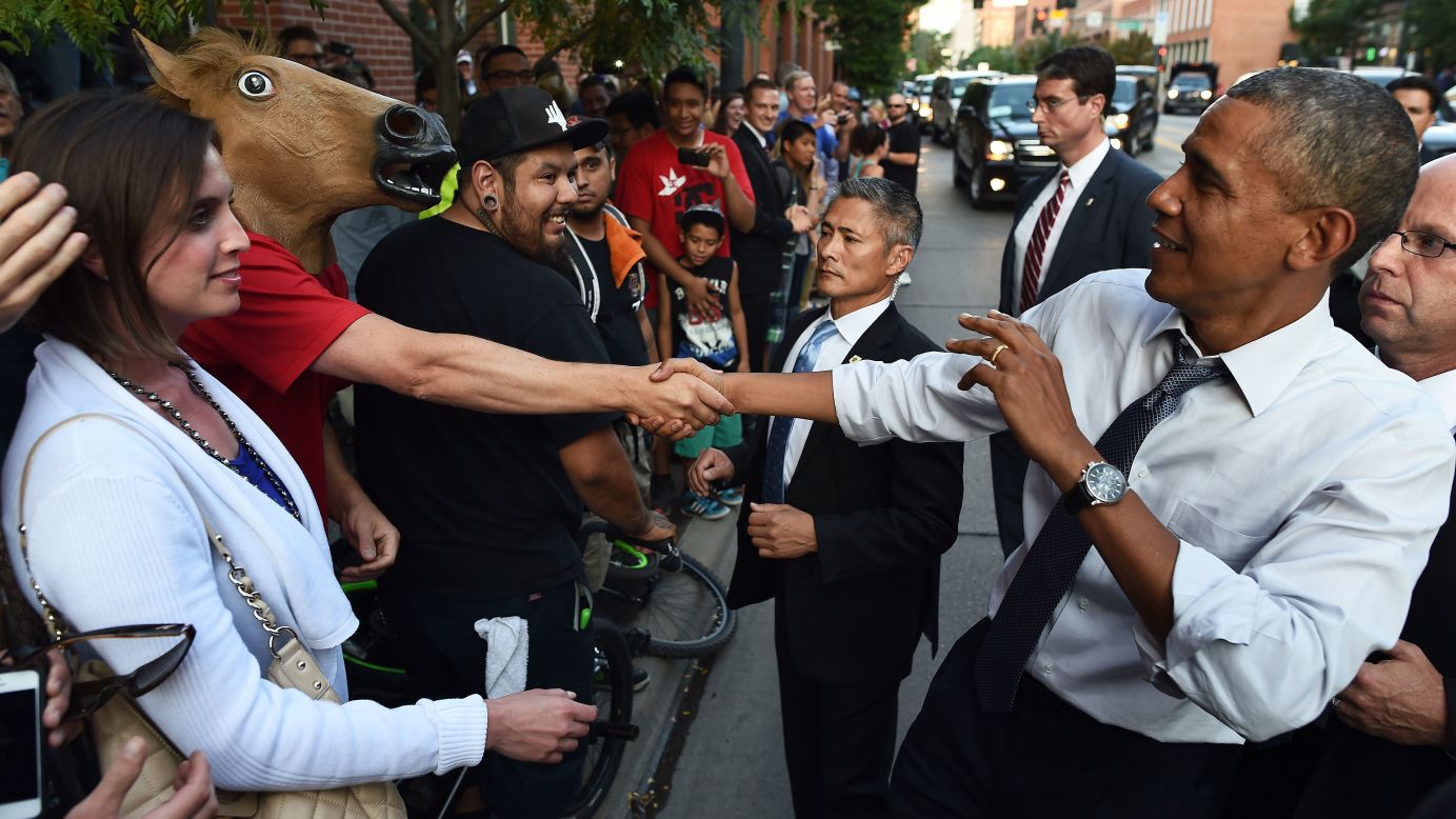 U.S. President Barack Obama shakes hands with a man wearing a horse mask Tuesday, July 8, in downtown Denver. Obama <a href="http://www.cnn.com/2014/07/09/politics/obama-denver-night-out/index.html">had an interesting night</a> in the city after he headlined a Democratic fundraiser earlier in the day. One man in a bar even offered marijuana to the President. As for the man in the horse mask, "it's unclear what message he hoped to convey," wrote the pool reporter assigned to cover the visit.