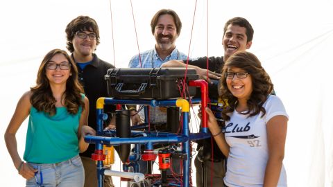 Teacher Fredi Lajvardi, with, from left, students Diserea Sanders, Sergio Corral , Martin Carranza, and Isela Martinez , and robot nicknamed "Stinky"
