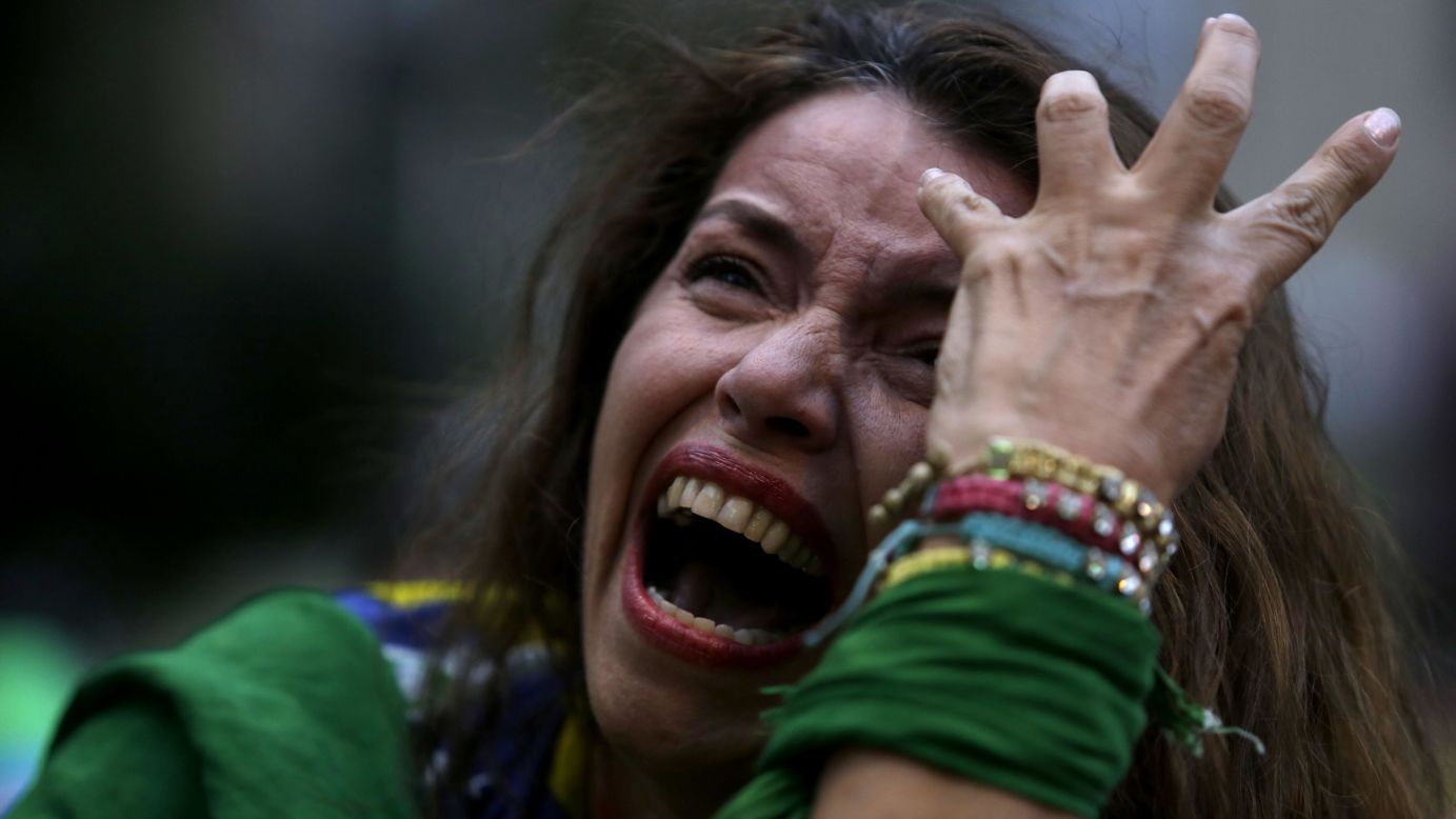 A Brazil soccer fan cries as she watches a live telecast of the <a href="http://www.cnn.com/2014/07/08/football/gallery/world-cup-best-0708/index.html">World Cup semifinal match</a> between Brazil and Germany on Tuesday, July 8. Many fans in Brazil were <a href="http://www.cnn.com/2014/07/08/worldsport/gallery/brazil-fans/index.html">overcome with emotion</a> after the national team lost 7-1 in Belo Horizonte, Brazil.
