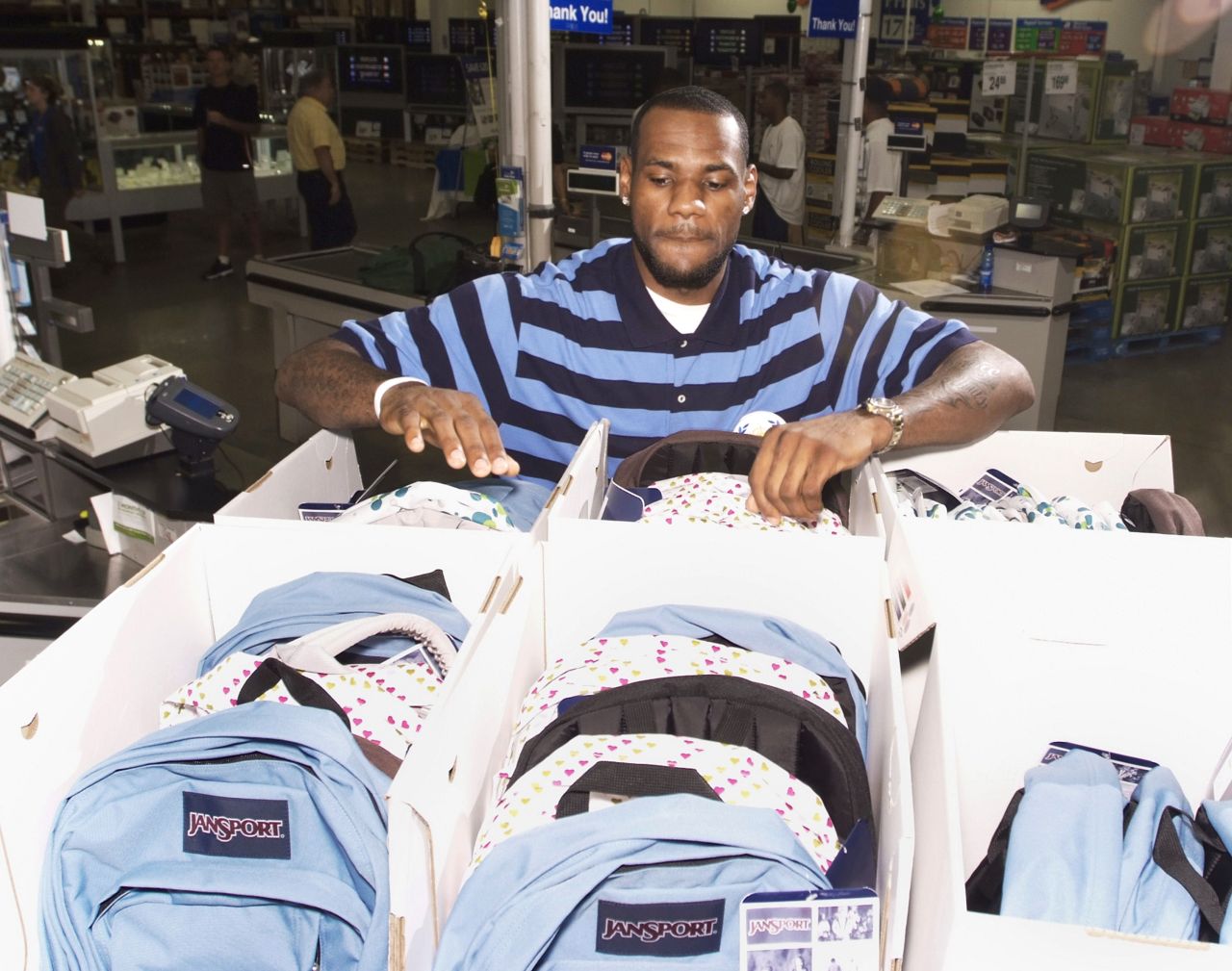 James looks over backpacks at Sam's Club in Cuyahoga Falls, Ohio, in August 2007. James runs a nonprofit organization called the LeBron James Family Foundation, which helps needy children in his hometown area.