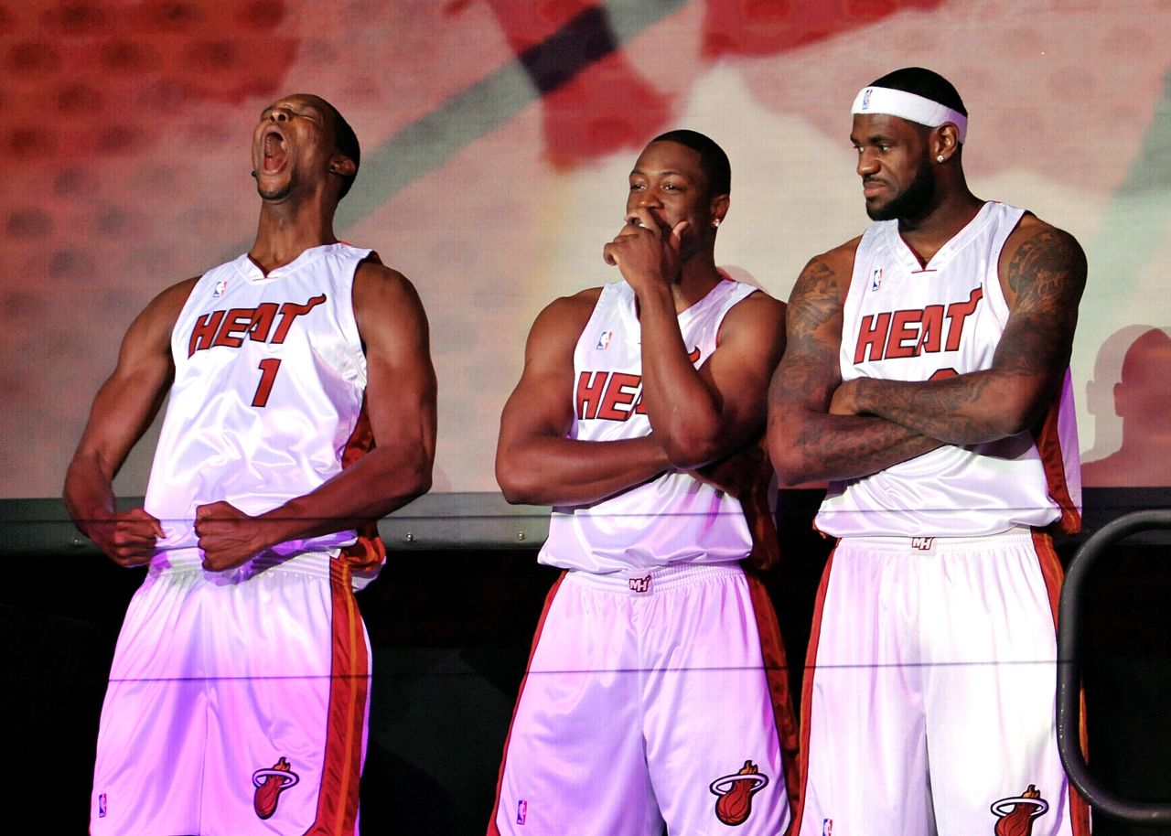 From left, Chris Bosh, Dwyane Wade and James are introduced to Miami Heat fans during a welcome party in Miami in July 2010. 