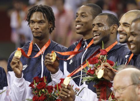 U.S. basketball players receive their gold medals after they defeated Spain at the 2008 Summer Olympics in Beijing. From left are Chris Bosh, Dwight Howard, James, Carlos Boozer and Michael Redd. James would also win a gold medal on the 2012 Olympic team.