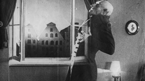 German actor Max Schreck (1879 - 1936), as the vampire Count Orlok, being destroyed by sunlight, in a still from F. W. Murnau's expressionist horror film, 'Nosferatu, Eine Symphonie Des Grauens', 1921. 