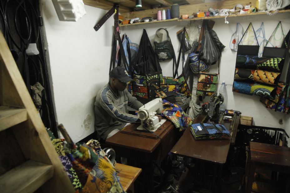 The business was founded by local entrepreneur Rizwan Janmohamed who wanted to offer souvenirs which were made from locally sourced materials to Zanzibar's many tourists. Craftsmen work busily in the back room of the shop, creating  everything from iPad and phone covers to guitar cases and can holders in vibrant African prints. 