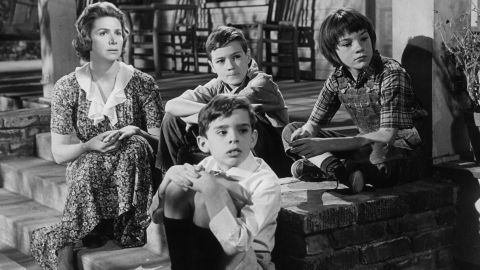Rosemary Murphy, left, sits with Mary Badham, top right, and other children in a scene from the film "To Kill A Mockingbird."