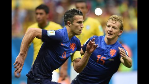 Netherlands forward and captain Robin van Persie, left, celebrates with Netherlands midfielder Dirk Kuyt after scoring a goal.