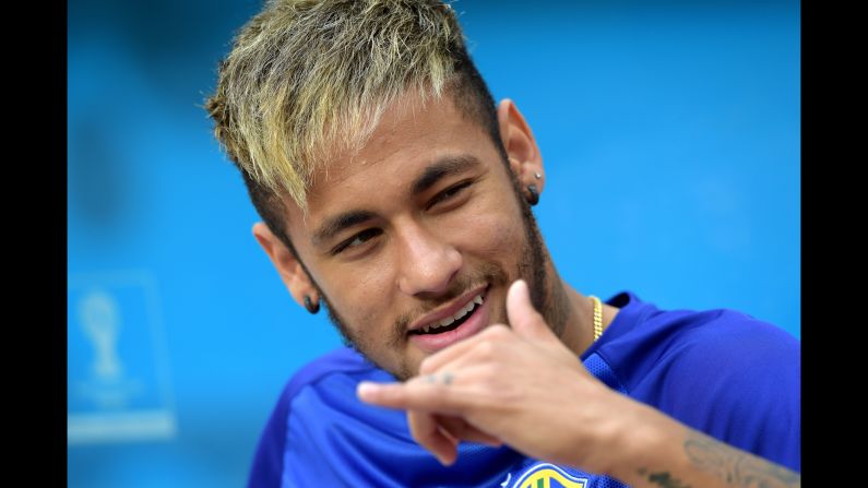 Injured Neymar of Brazil looks on during the warmup prior to the game.