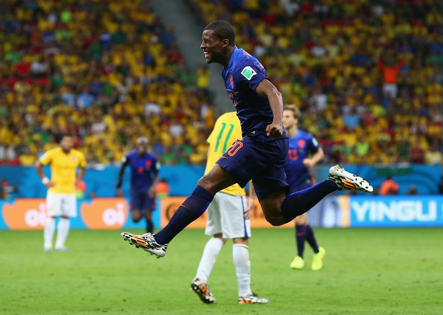 Georginio Wijnaldum of the Netherlands celebrates scoring his team's third goal during the third-place playoff match against Brazil on Saturday, July 12, in Brasilia, Brazil. The Netherlands defeated Brazil 3-0. 
