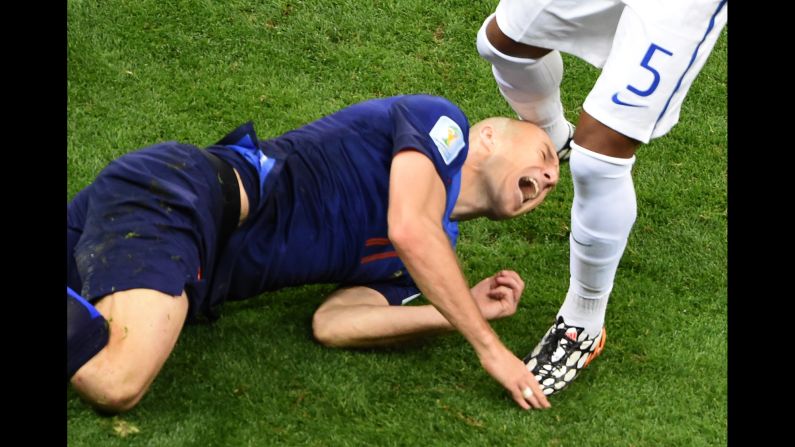 Netherlands forward Arjen Robben hits the ground.