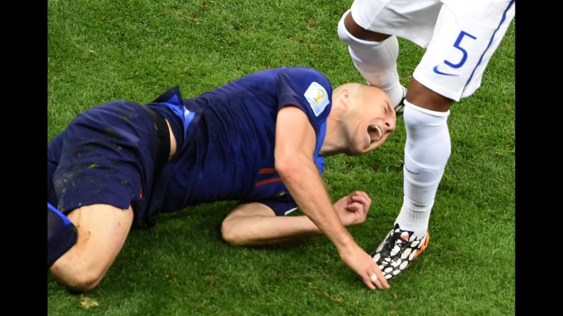 Netherlands forward Arjen Robben hits the ground. 