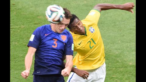 Netherlands defender Stefan de Vrij, left, and Brazil forward Jo vie for the ball. 