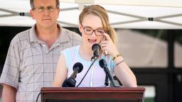 Cassidy Stay, speaks during a memorial service for the Stay family at Lemm Elementary School on Saturday, July 12, 2014, in Spring, Texas. Cassidy was grazed in the head during Wednesday's attack that killed her parents and four siblings. She played dead until the shooter left, then despite suffering a fractured skull managed to call 911. (AP Photo/Conroe Courier, Michael Minasi)