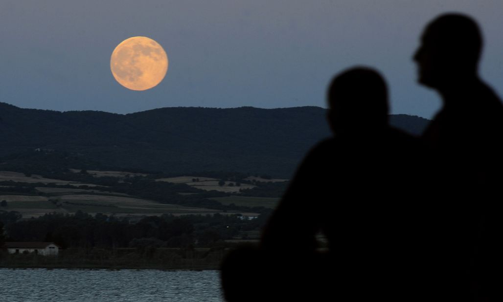 The moon is seen as it rises above Dojran Lake in southeastern Macedonia. NASA says that there will be three "supermoons" this year, occuring on July 12, August 10 and September 9.