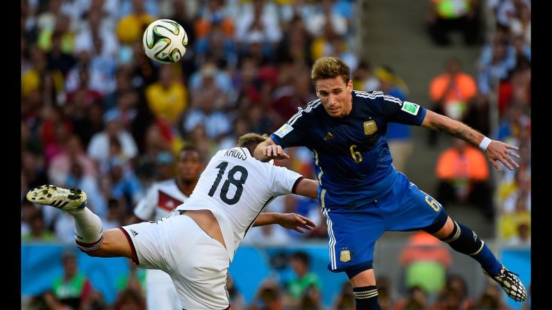 Germany's Toni Kroos, left, collides with Biglia.