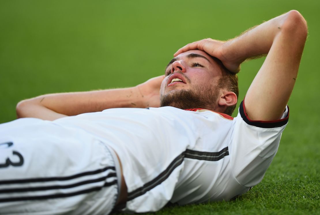 Christoph Kramer of Germany lies on the pitch after a collision during the 2014 World Cup final against Argentina.