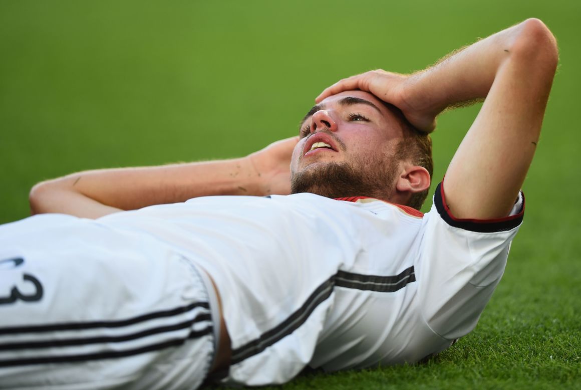 Germany's Christoph Kramer lies on the field after a collision in the first half. He later had to be substituted.