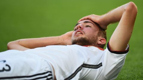 Christoph Kramer of Germany lies on the pitch after a collision during the 2014 World Cup final against Argentina.