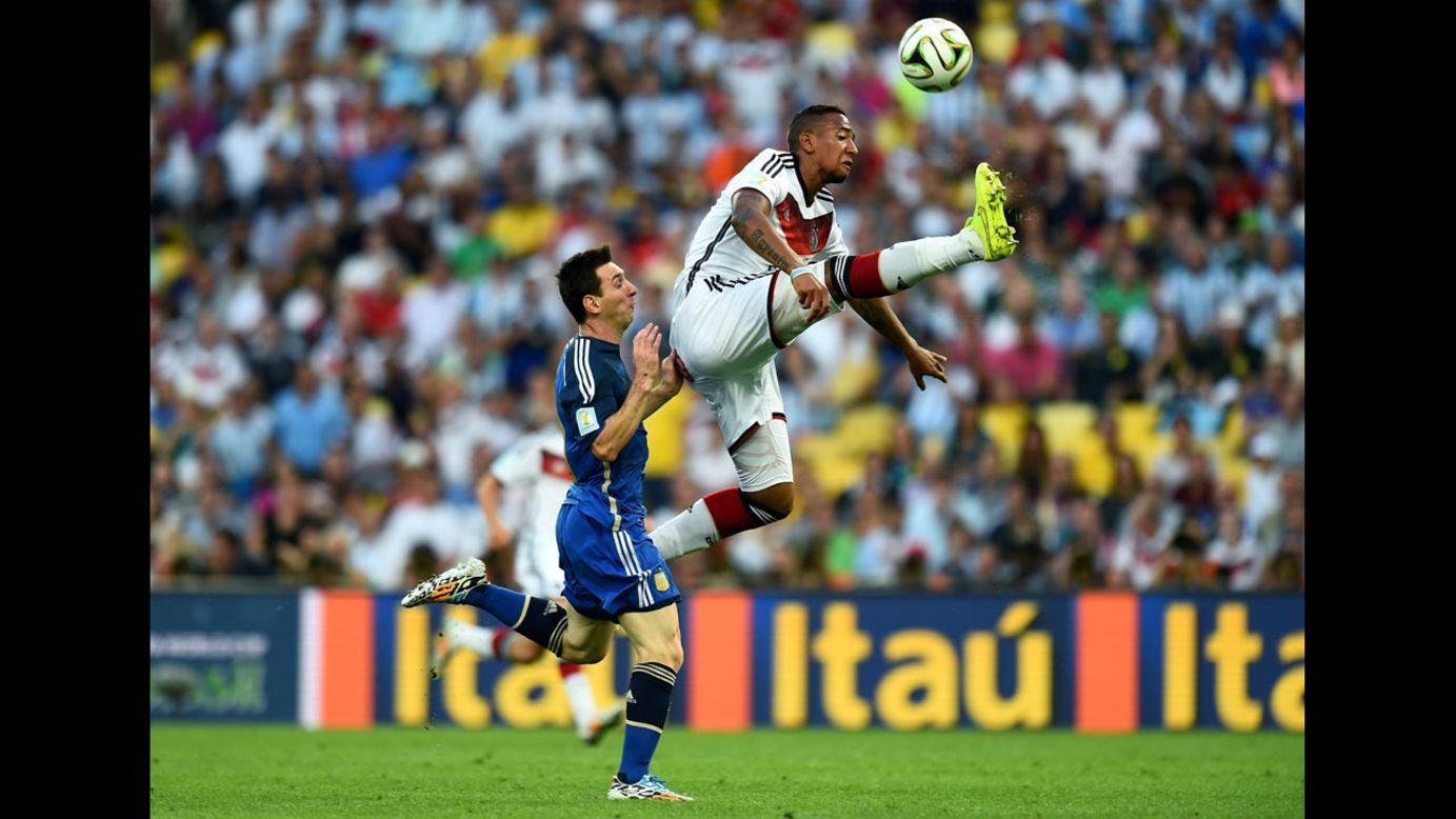 Boateng leaps for the ball.