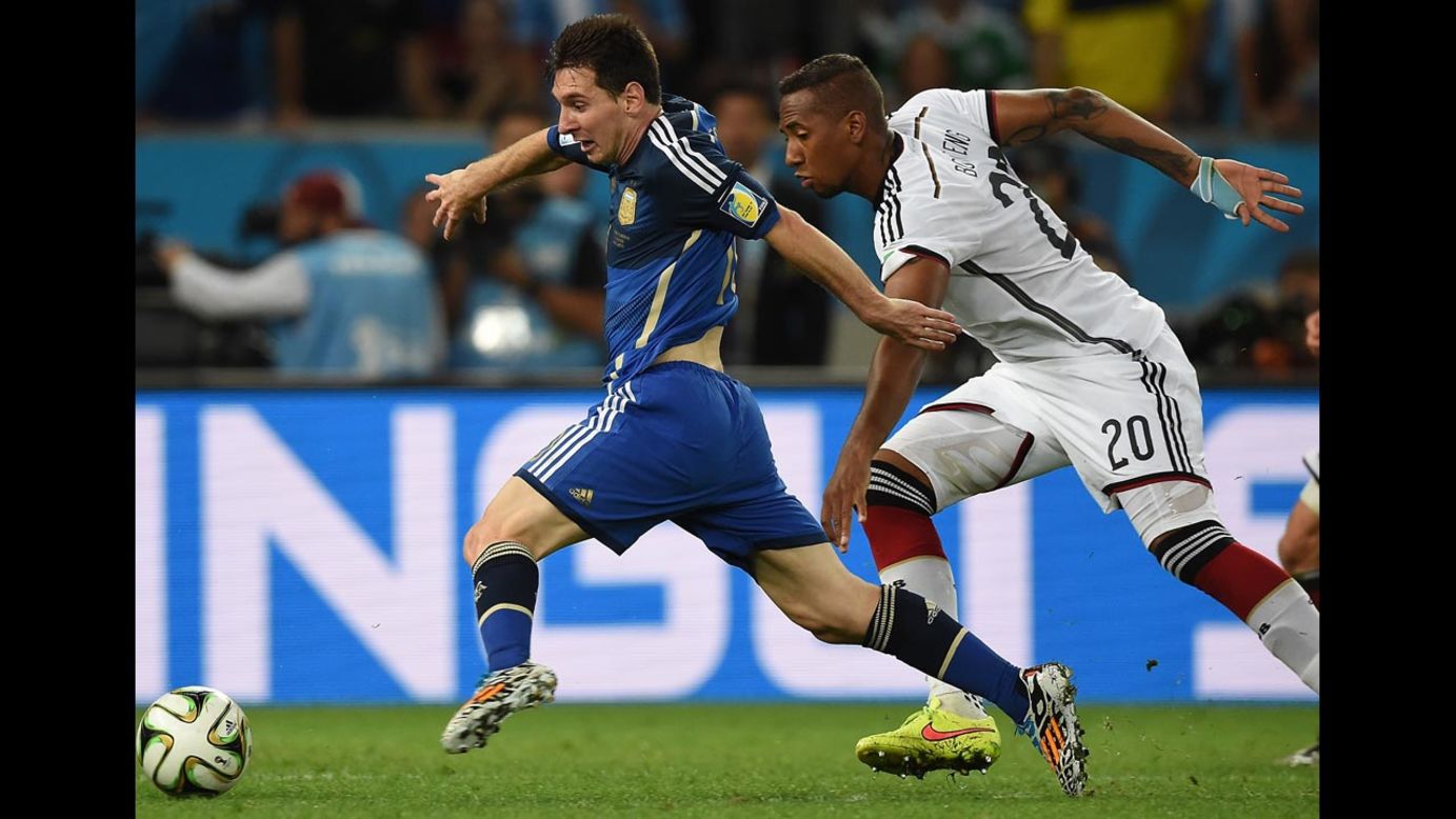 Messi, left, dribbles past German defender Jerome Boateng.