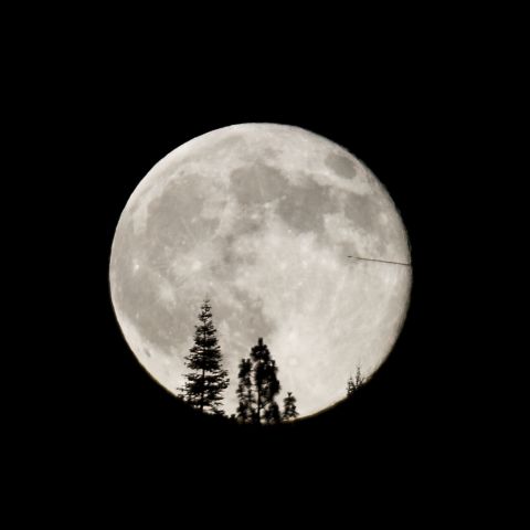 <a href="http://ireport.cnn.com/docs/DOC-1152039">Kelli Thompson</a> photographed the supermoon from the foothills of the Sierra Nevada Mountains in California. "The airplane bisecting the supermoon was quite unusual and unexpected," she said.