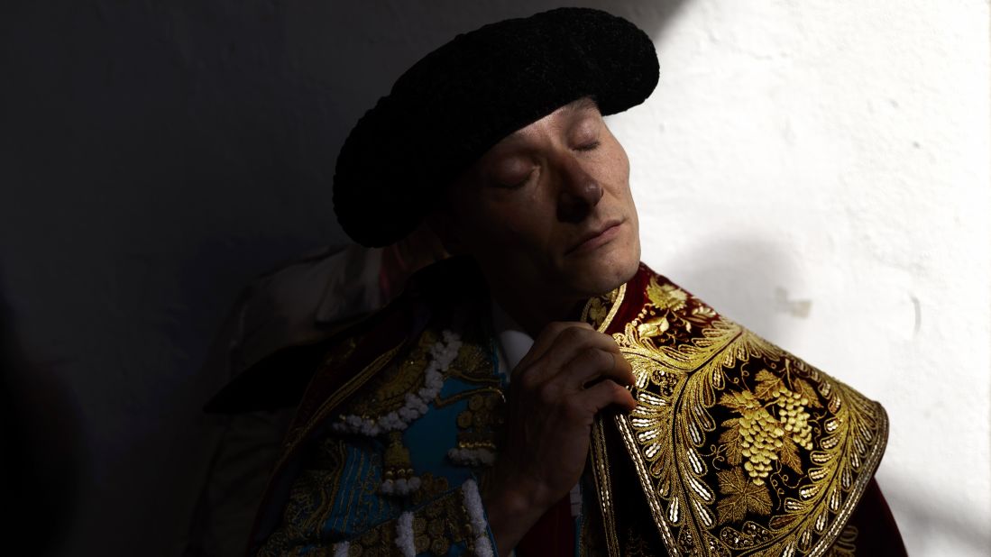 Bullfighter Diego Urdiales adjusts his capote before doing the "paseillo," or ritual entrance to the arena, before a bullfight on Sunday, July 13.