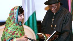Pakistani education activist Malala Yousafzai (L) watches on July 14, 2014 Nigerian President Goodluck Jonathan look at a book at the State House in Abuja. Malala on July 14 urged Jonathan to meet with parents of the schoolgirls kidnapped three months ago by Boko Haram. Malala, who survived a Taliban assassination attempt in 2012 and has become a champion for access to schooling, was in Abuja on her 17th birthday to mark the somber anniversary of Boko Haram's April 14 abduction of 276 girls from a secondary school in the northeast Nigerian city of Chibok. 
AFP PHOTO / WOLE EMMANUELWOLE EMMANUEL/AFP/Getty Images

