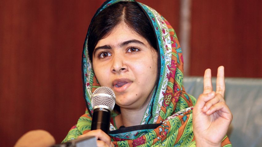 Caption:Pakistani education activist Malala Yousafzai gives a press conference on July 14, 2014 after meeting with the Nigerian president in Abuja. Malala on July 14 urged Nigerian President Goodluck Jonathan to meet with parents of the schoolgirls kidnapped three months ago by Boko Haram. Malala, who survived a Taliban assassination attempt in 2012 and has become a champion for access to schooling, was in Abuja on her 17th birthday to mark the somber anniversary of Boko Haram's April 14 abduction of 276 girls from a secondary school in the northeast Nigerian city of Chibok. AFP PHOTO / WOLE EMMANUEL (Photo credit should read WOLE EMMANUEL/AFP/Getty Images)
