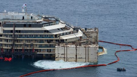 Water is expelled from the caissons hooked onto the Costa Concordia on Monday, July 14. The ship will be towed north to the port in Genoa, Italy.