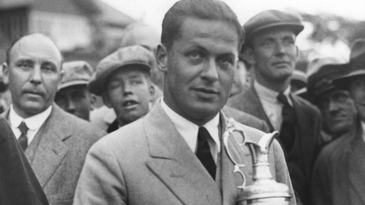 Jones clutches the Claret Jug after his triumph. Having secured both British titles on offer, he headed back home to complete the grand slam by winning the U.S. Open and the U.S. Amateur -- taking him to 13 majors overall.