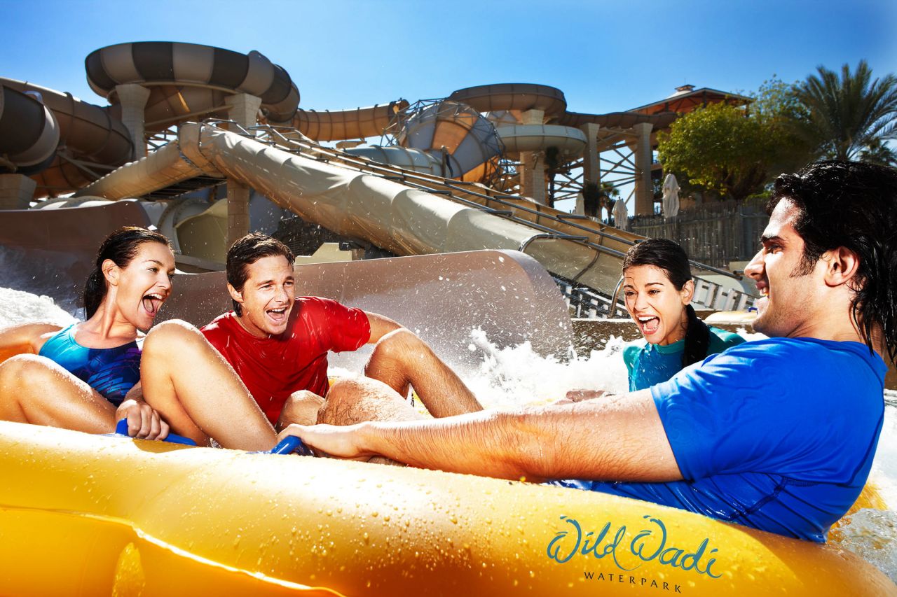 Surfing machines, water slides and an artificial waterfall refresh crowds in the desert heat at Wild Wadi Water Park in Dubai, named sixth-best water park.