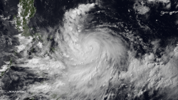 Satellite image shows Rapu-Rapu Island in the Philippines in the center of the eye of Typhoon Rammasun on Tuesday, July 15, 2014. Typhoon Rammasun is well-structured with a 20 nautical mile diameter eye after rapid intensification overnight. As the storm tracks toward Manila weakening its forecast as it interacts with land bringing with it possibilities for heavy flooding and mudslides. Rammasun is expected to reintensify as it enters the South China Sea due to a favorable upper-level environment and warm sea surface temperatures. Landfall on northern Hainan Island is expected in three days, and the storm is expected to maintain Typhoon strength for its final landfall in northern Vietnam near Hanoi.