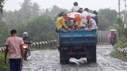 Residents ride on a truck as they are evacuated by authorities from the approaching Typhoon Rammasun in Legazpi City, southeast of Manila on July 15, 2014. Thousands of people fled their homes and ships sheltered from heavy seas in the Philippines on July 15 as the first major storm of the rainy season strengthened into a typhoon. AFP PHOTO / CHARISM SAYATCharism SAYAT/AFP/Getty Images