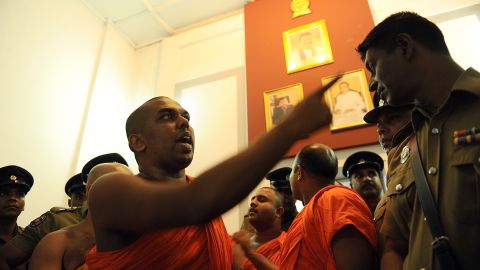 A monk from the BBS remonstrates with a police officer at the Trade Ministry in Colombo in April.