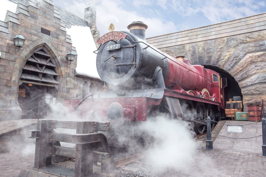 The famed scarlet Hogwarts Express steam engine is on display at Hogsmeade Station.