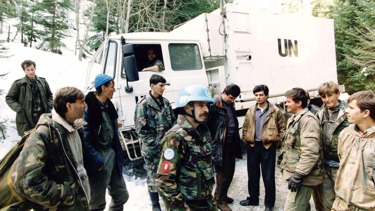(FILES) -- A file photo taken on March 1, 1994 shows Dutch soldiers of a Dutchbat convoy chatting with Bosnian Muslim fighters in Vares, Bosnia. A court in the Netherlands ruled on July 16, 2014 that the Dutch state was responsible for the deaths of over 300 victims of the Srebrenica massacre, the worst atrocity on European soil since World War II. "The state is liable for the loss suffered by relatives of the men who were deported by the Bosnian Serbs from the Dutchbat (Dutch battalion) compound in Potocari in the afternoon of 13 July, 1995, " the court said. Relatives had launched a lawsuit accusing Dutch UN peacekeepers of failing to protect the 8,000 Muslim men and boys killed.