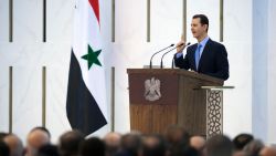 A handout picture released by the official Syrian Arab News Agency (SANA) on July 16, 2014, shows Syrian President Bashar al-Assad being sworn in for a new seven-year term, during a ceremony at the Presidential Palace in Damascus. Assad, 48, won a June election denounced as a "farce" by his detractors as it was staged more than three years into a devastating war that has killed more than 170,000 people and uprooted millions.