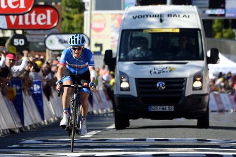 Andrew Talansky finishes the 11th stage of the Tour de France with the 'broom wagon' behind him after bravely struggling because of previous injuries. 
