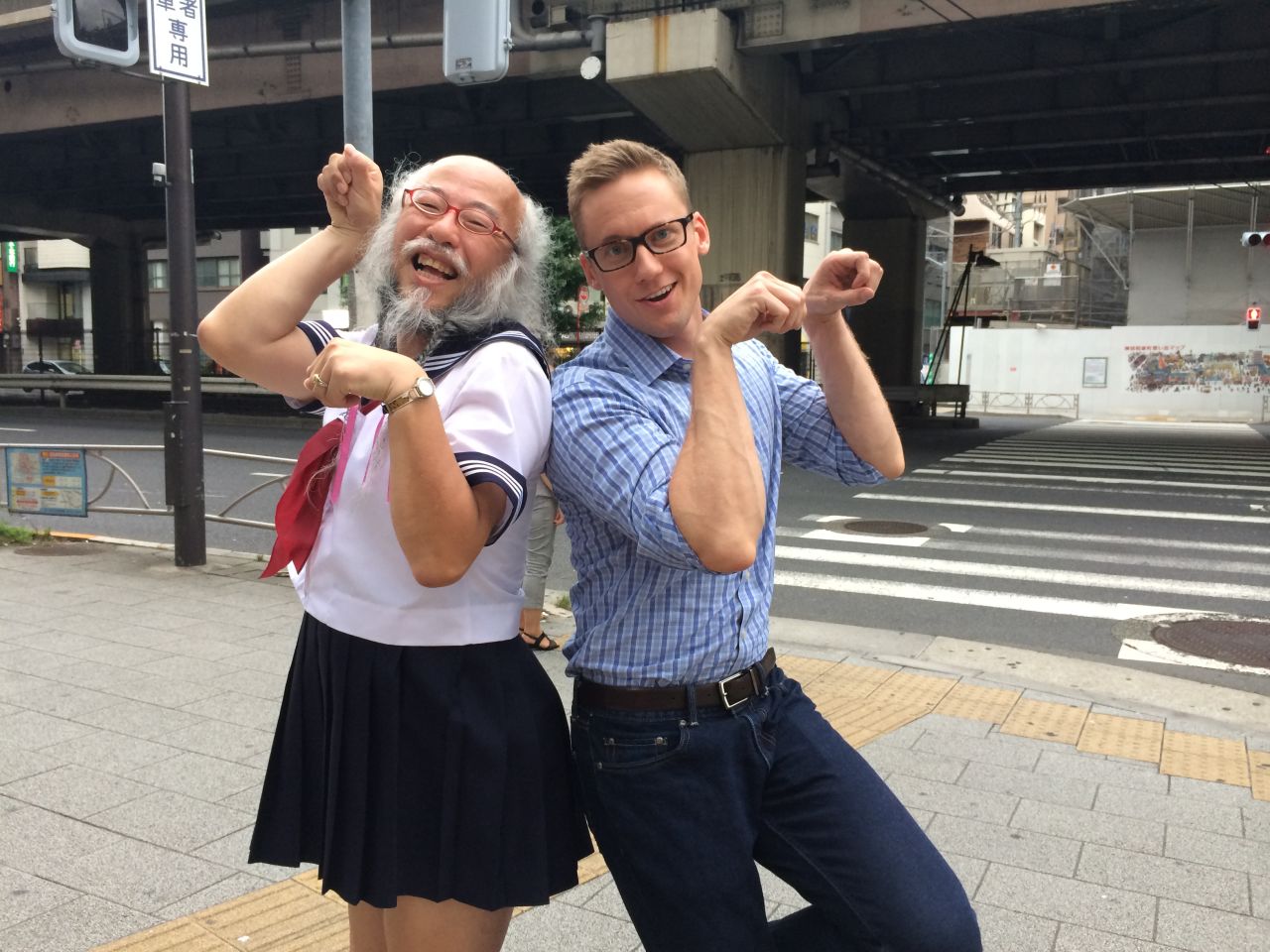 CNN correspondent Will Ripley makes an unsuccessful attempt to mimic Kobayashi's signature pose after interviewing him.  