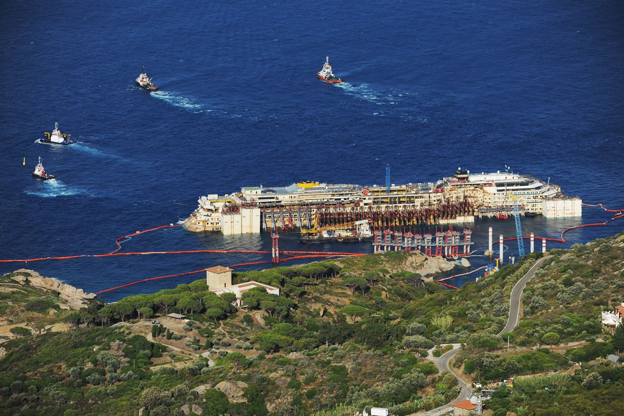 Tugboats pull the Costa Concordia after the first stage of the refloating operation on Wednesday, July 16. 