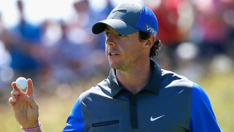 Rory McIlroy had reason to smile after an opening six-under 66 gave him the lead at the British Open at Hoylake.